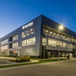 A modern office building at dusk.