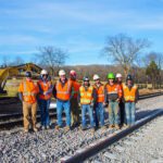 Dirt crew wearing PPE.